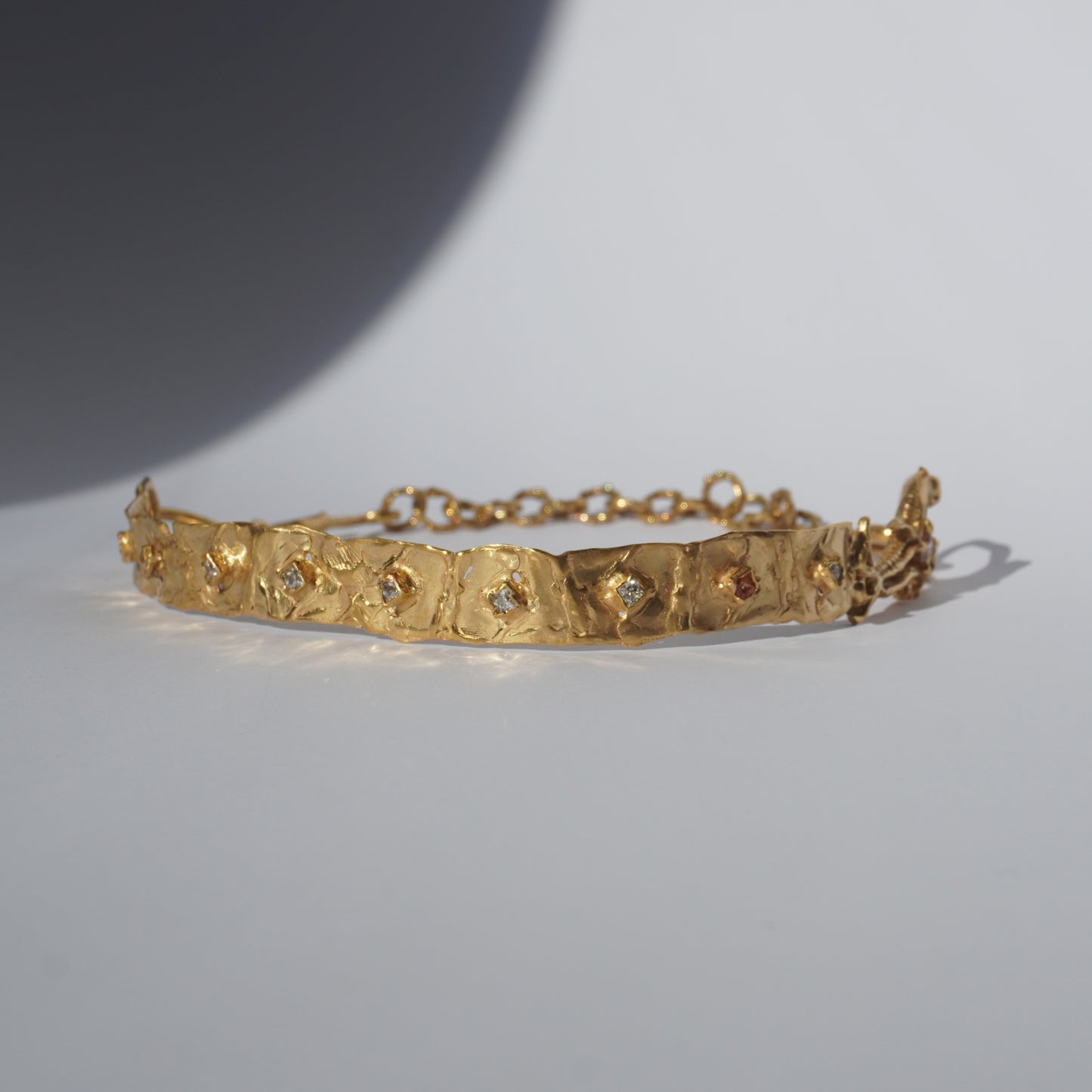Gold-plated handcrafted choker with organic links and hand-set stones by Tobe Atelier