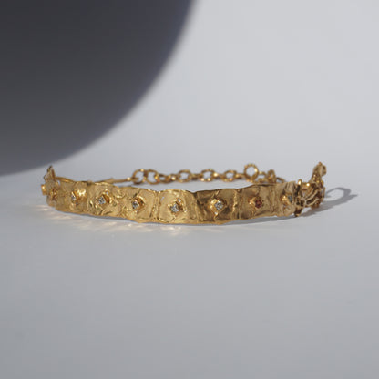 Gold-plated handcrafted choker with organic links and hand-set stones by Tobe Atelier
