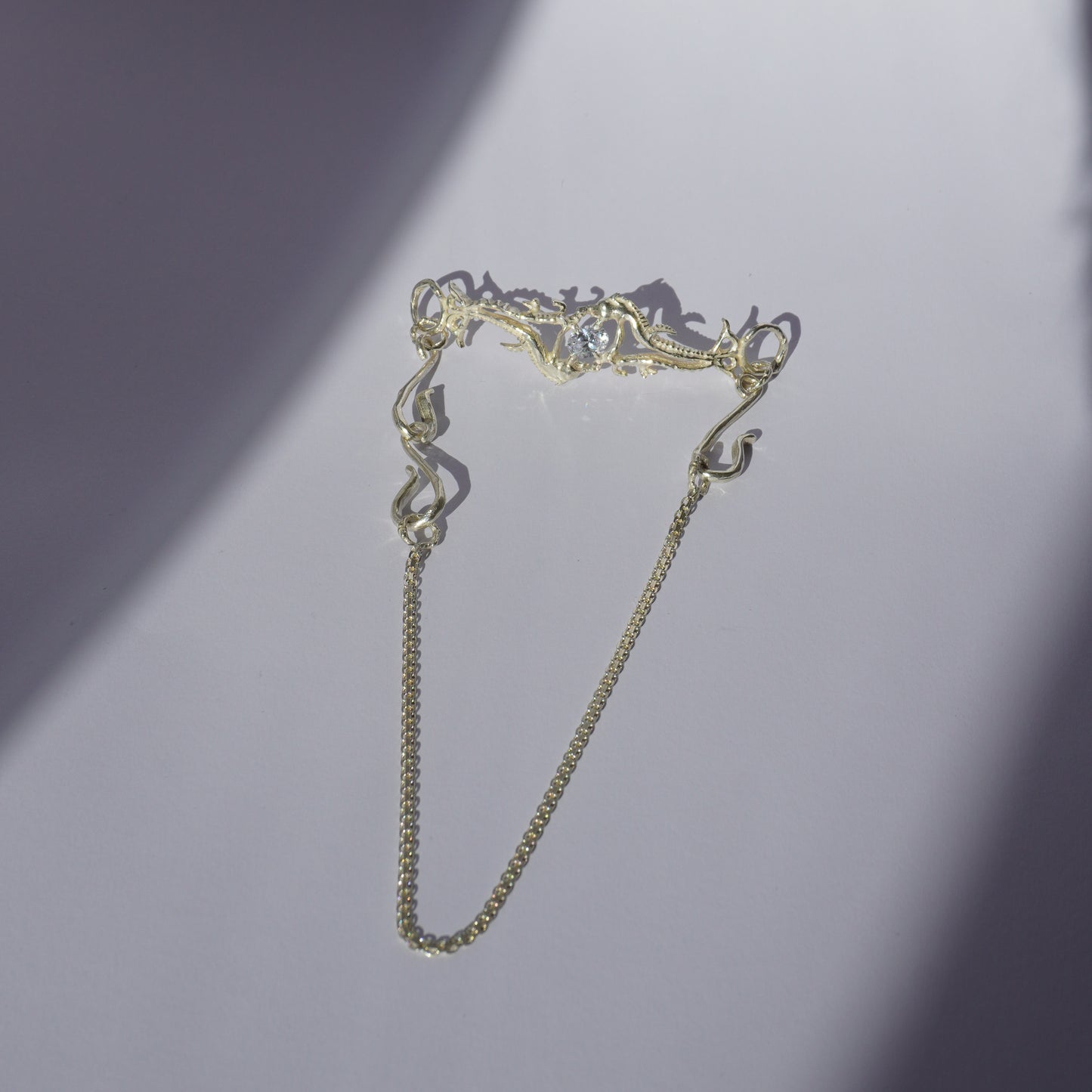 Gold-plated handcrafted choker with organic sculptural centerpiece and a hand-set stone