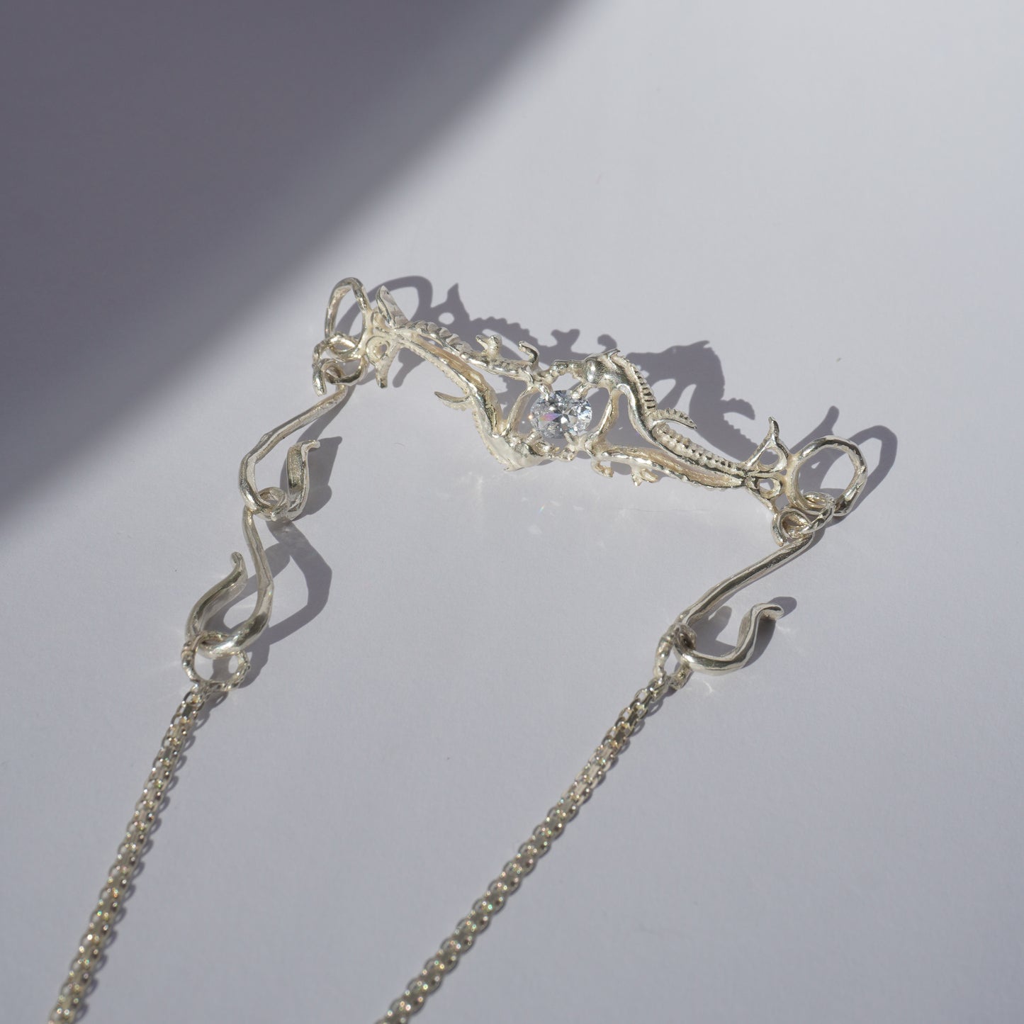 Gold-plated handcrafted choker with organic sculptural centerpiece and a hand-set stone