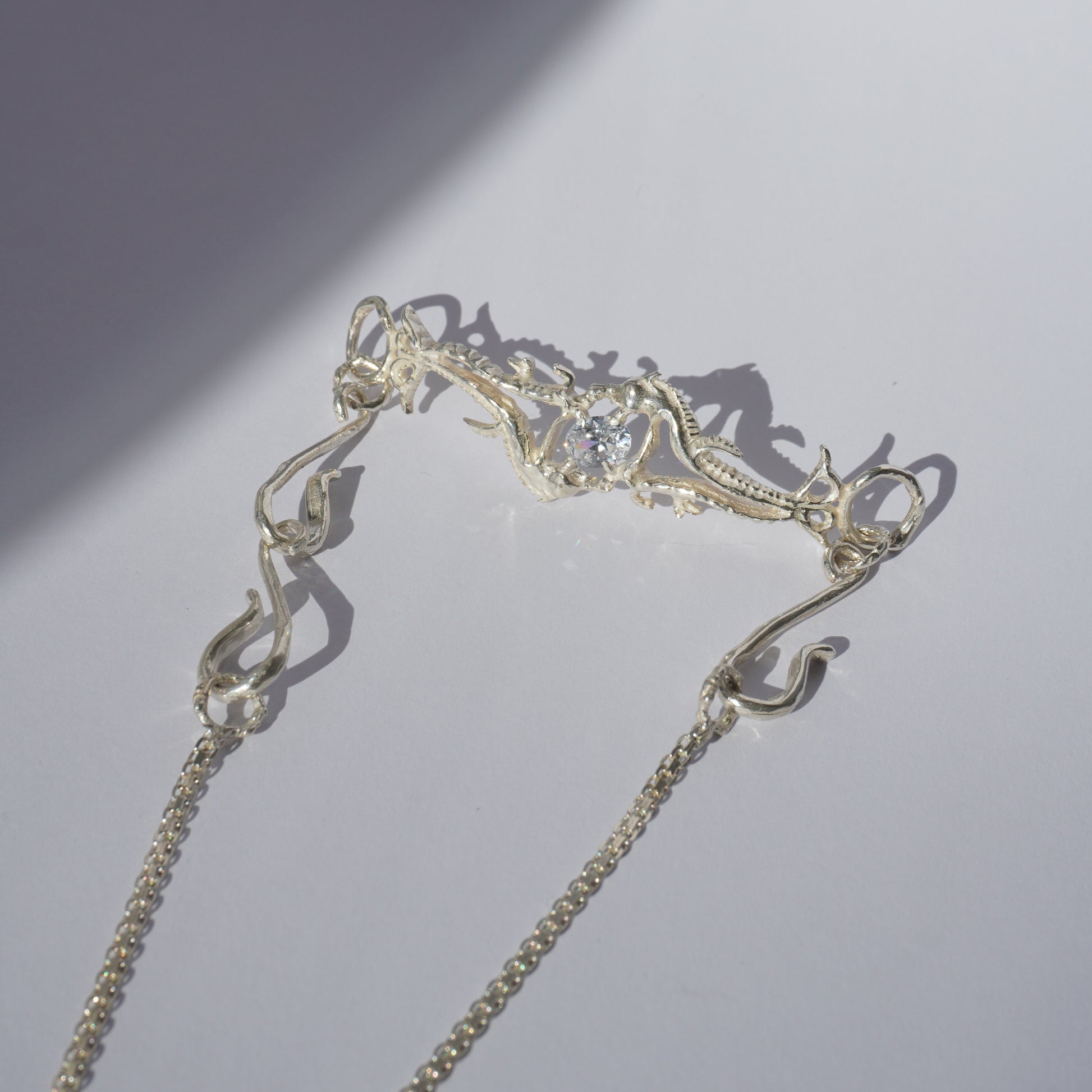 Gold-plated handcrafted choker with organic sculptural centerpiece and a hand-set stone