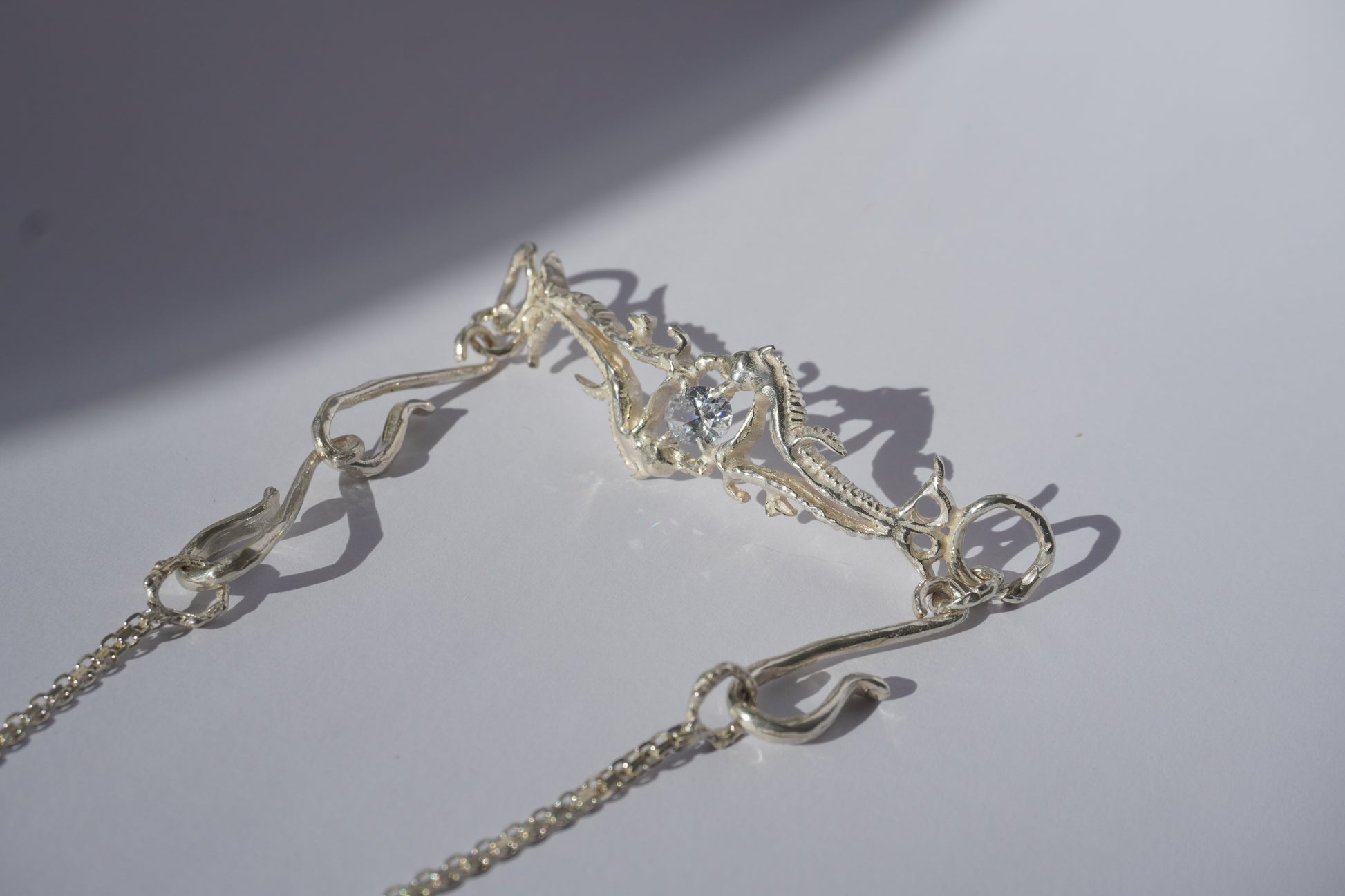 Gold-plated handcrafted choker with organic sculptural centerpiece and a hand-set stone