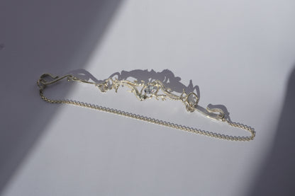 Gold-plated handcrafted choker with organic sculptural centerpiece and a hand-set stone