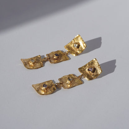 Gold-plated handcrafted earrings with organic sculptural elements and hand-set gemstones