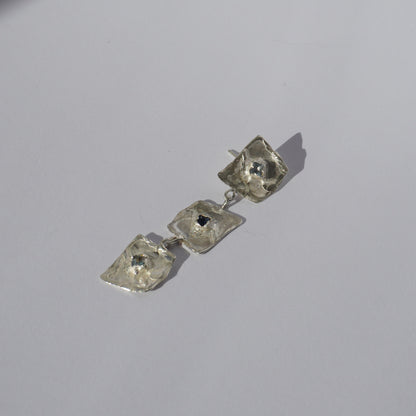 Silver handcrafted earrings with organic sculptural elements and hand-set gemstones