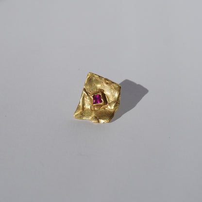 Gold-plated handcrafted stud earrings with organic sculptural surfaces and red hand-set gemstones