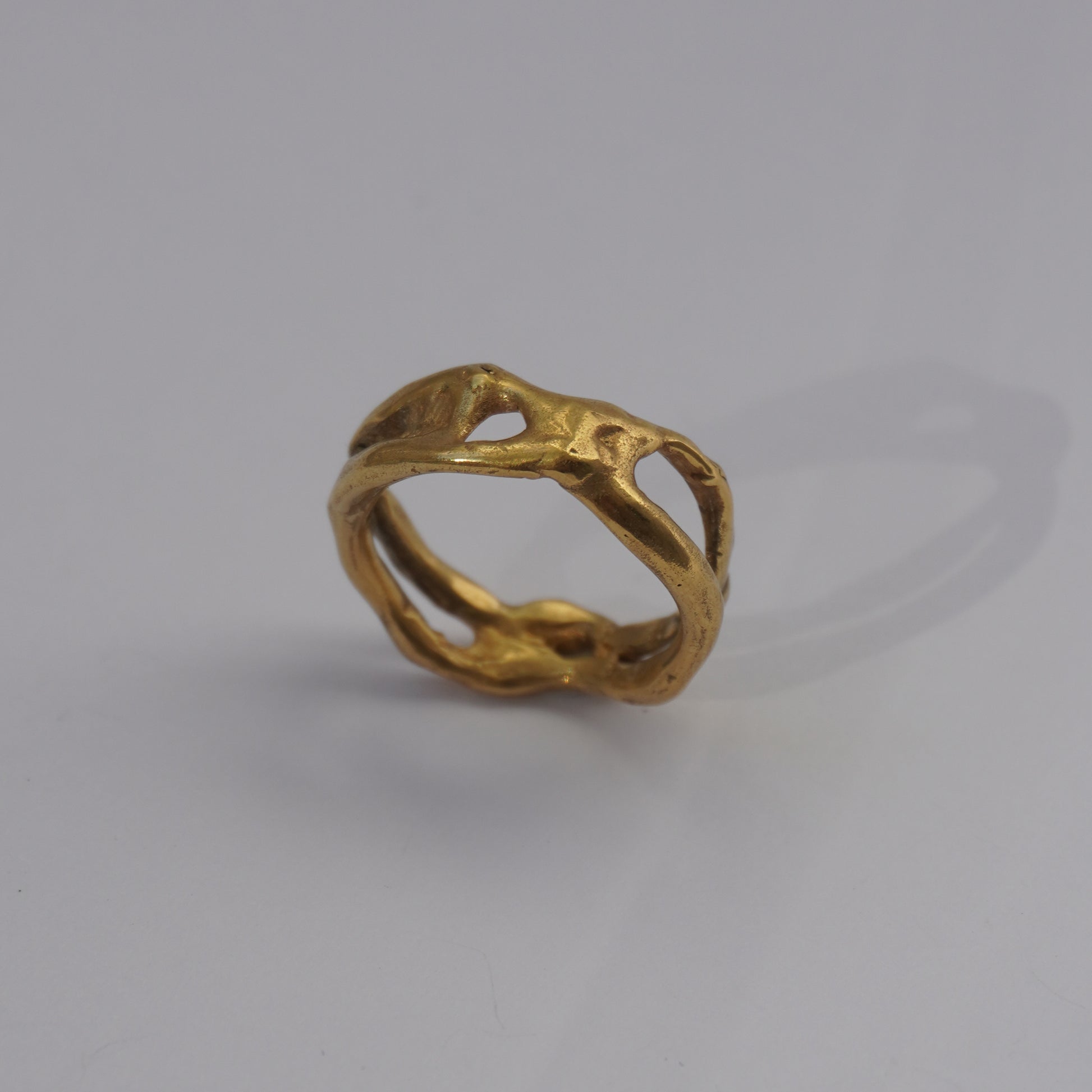 Handcrafted organic openwork gold-plated ring with sculpted natural shapes