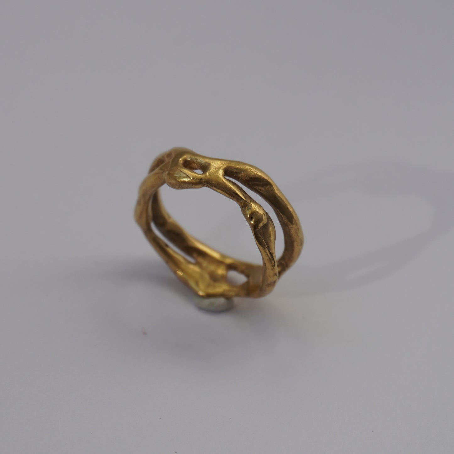 Handcrafted organic openwork gold-plated ring with sculpted natural shapes