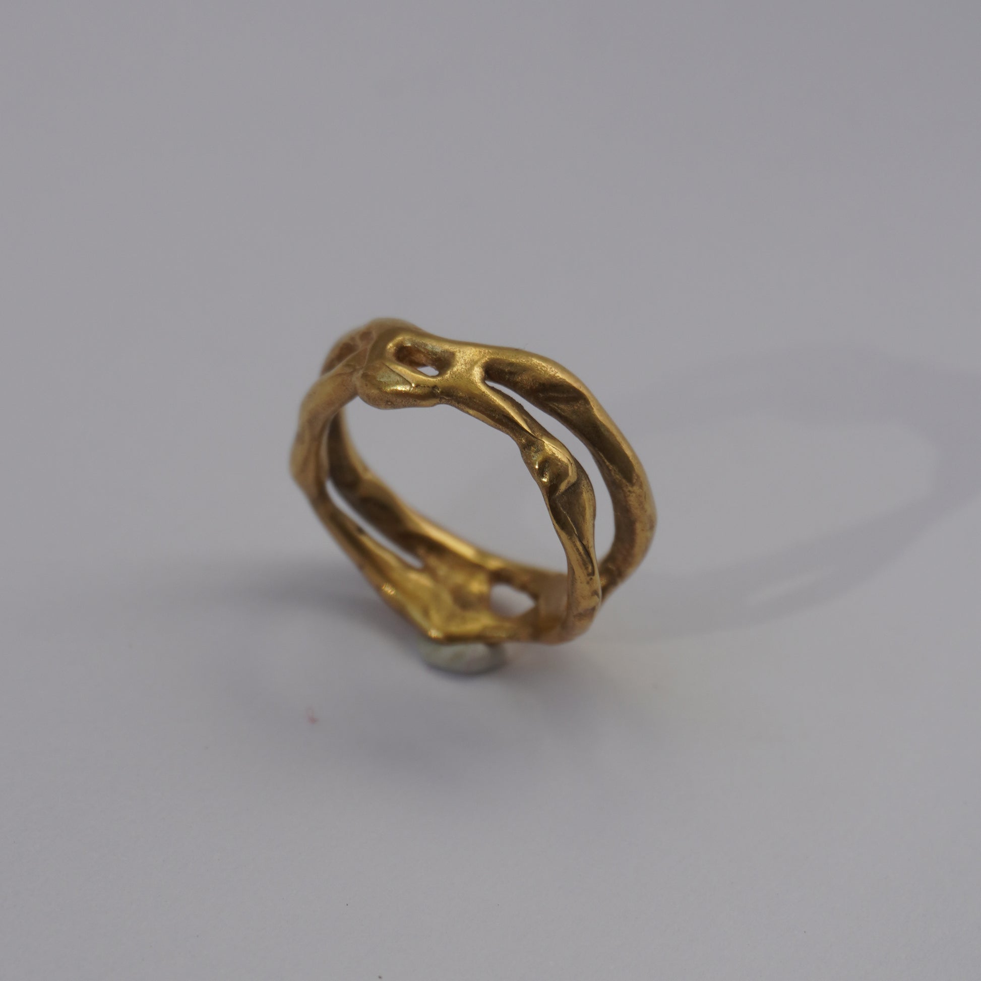 Handcrafted organic openwork gold-plated ring with sculpted natural shapes
