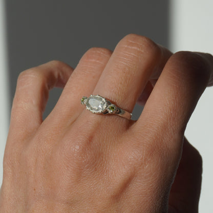 Handcrafted silver ring with organic oval centerpiece and sculpted details