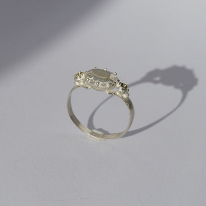 Handcrafted silver ring with organic oval centerpiece and sculpted details