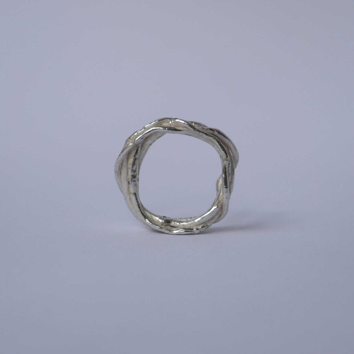 Twisted Band Silver Ring with Olive Green Cubic Zirconias