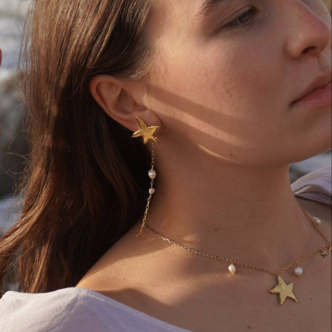 Necklace with organic shaped moon, star and natural pearl pendants, gold-plated