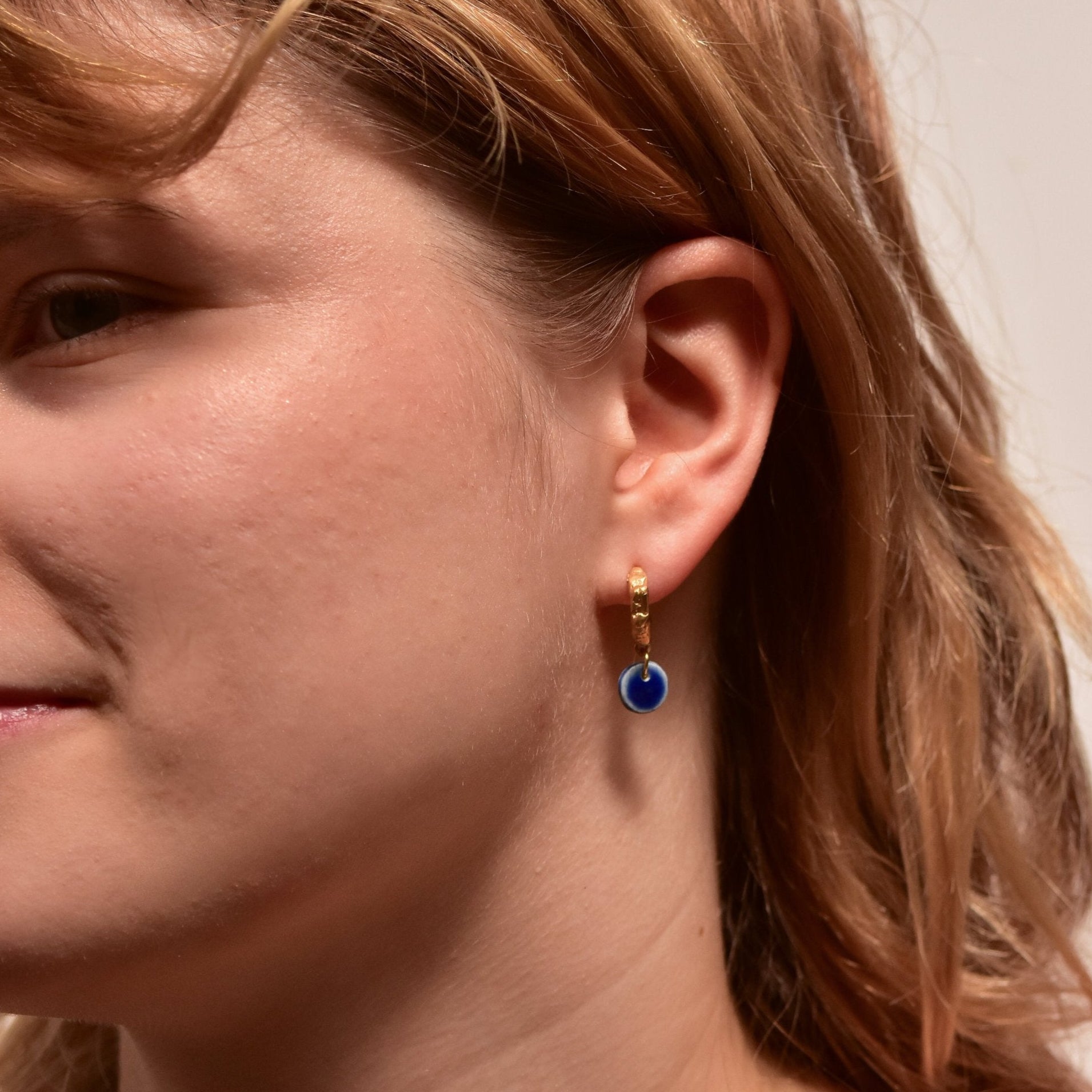 organic gold hoop earring round porcelain pendant blue
