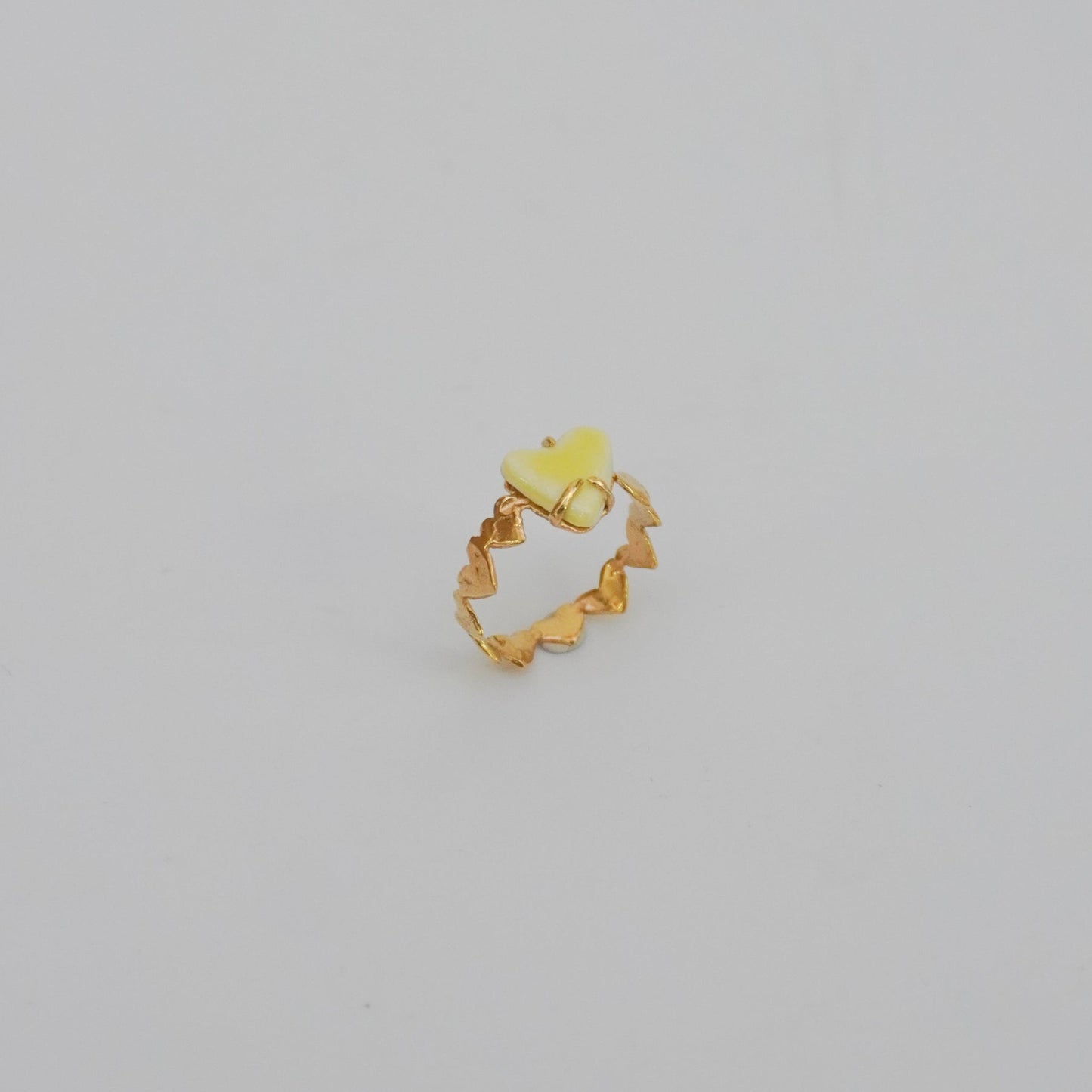 Gold-plated love ring with porcelain yellow stone