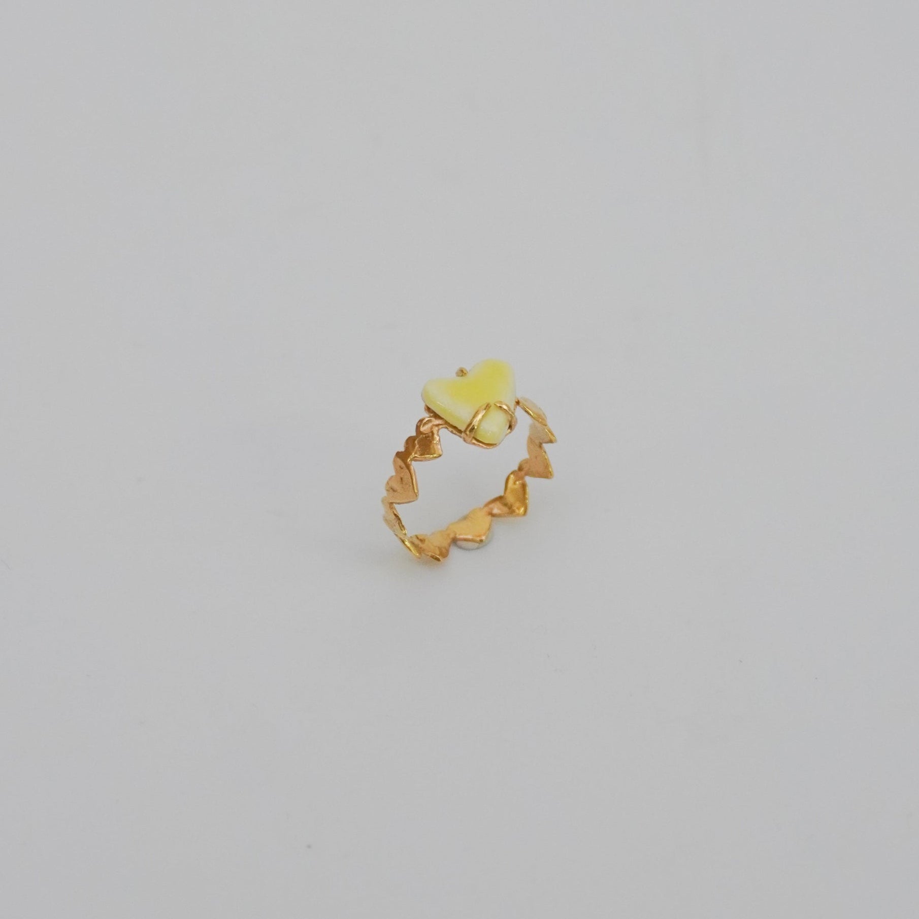 Gold-plated love ring with porcelain yellow stone