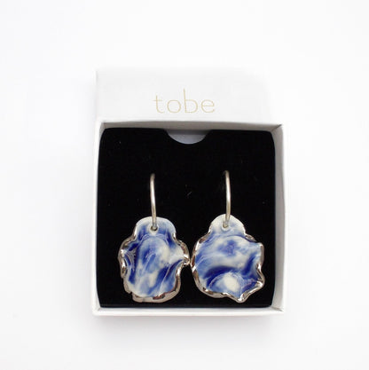 Resilience hoop porcelain earrings blue with silver luster detail