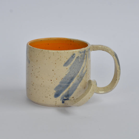 Handmade mug with a twisted handle for creative holding