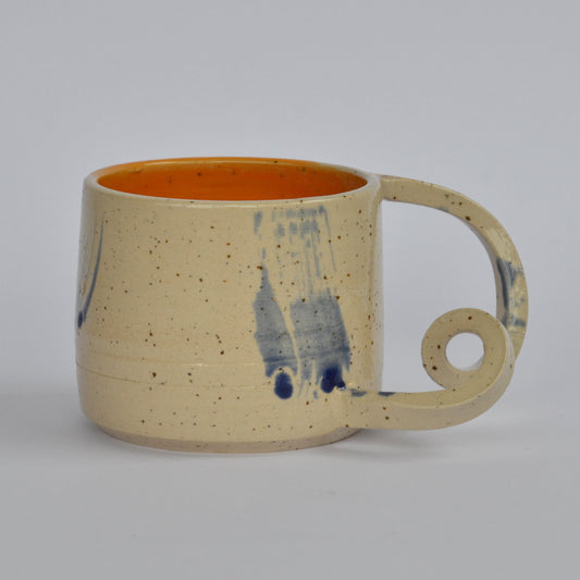 Handmade mug with a twisted handle for creative holding