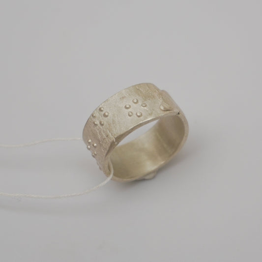 Handcrafted premium sterling silver ring with intricate dot detailing. Unique rough texture and artisanal craftsmanship