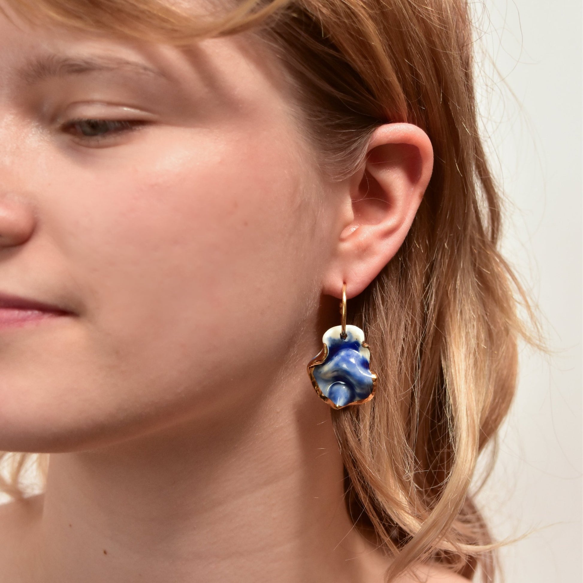 midnight calm resilience blue earring porcelain gold luster detail